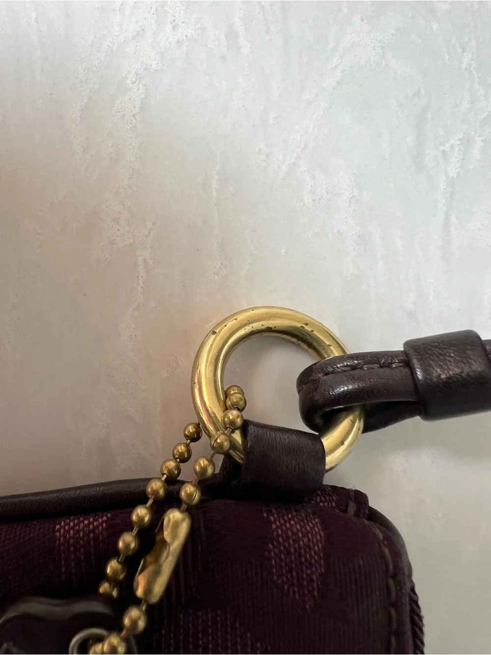 Purple jacquard Coach wristlet